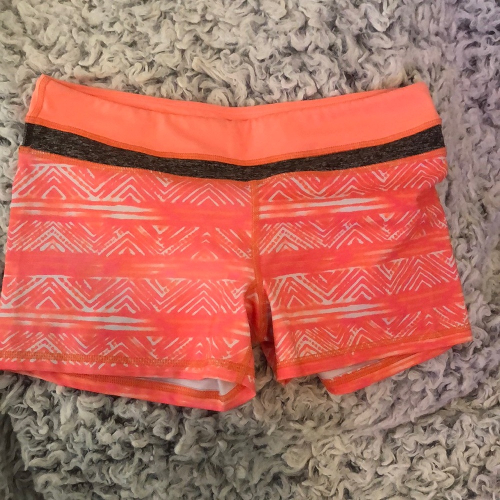 Coral patterned gym shorts. Size M, like new